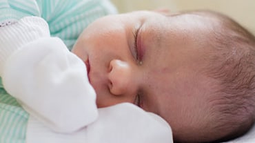 newborn with pink eye